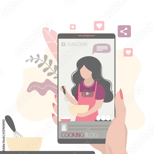  Female food blogger tells how to cook a dish. Video application on mobile phone.