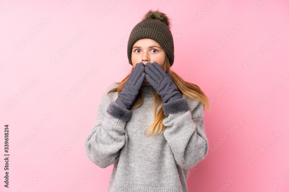 Ukrainian teenager girl with winter hat over isolated pink background with surprise facial expression Ukrainian teenager girl with winter hat over isolated pink background with surprise facial expression
