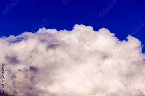 Large multi-colored clouds on a blue sky. Dark storm clouds. overcast sky