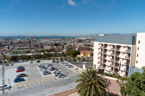 Cape Town, South Africa. 2019. Hotel and car park with a view across housing and Cape Town port #339619001
