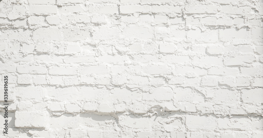 White brick wall background. Neutral texture of a brick wall close-up. White brick wall background. Neutral texture of a brick wall close-up.
