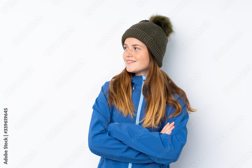 Ukrainian teenager girl with winter hat over isolated white background laughing Ukrainian teenager girl with winter hat over isolated white background laughing
