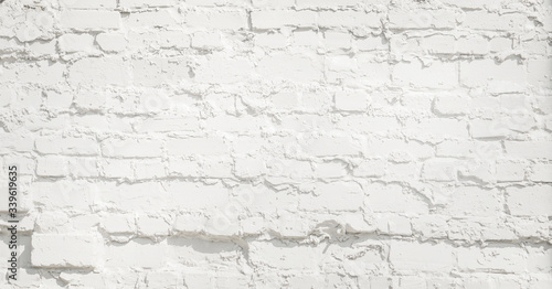 White brick wall background. Neutral texture of a brick wall close-up.