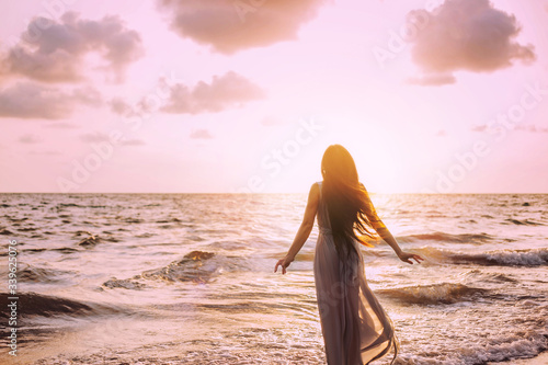 Konstfotografi Art dark mysterious silhouette woman on sea shore nature air
