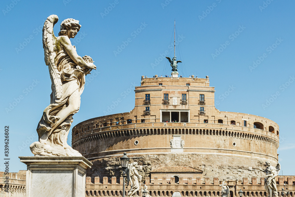 Statues with castle saint Angelo background. Rome, Italy