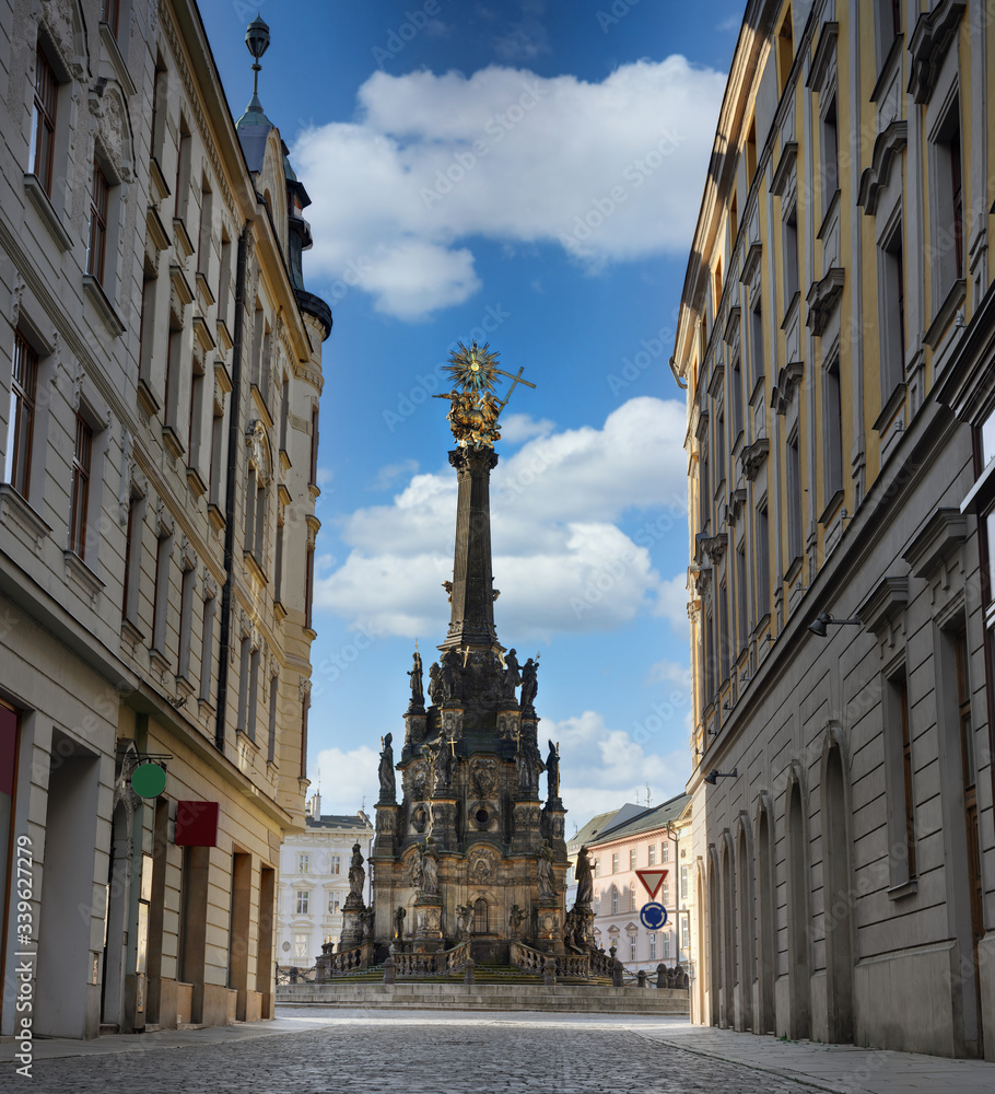 Olomouc - baroque pearl of Moravie - Pedestrian street with view to main square and monument of Holy Trinity Column in historic centre Olomouc town