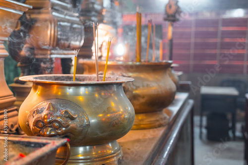 Photography Incense burning in a big bronze cauldron