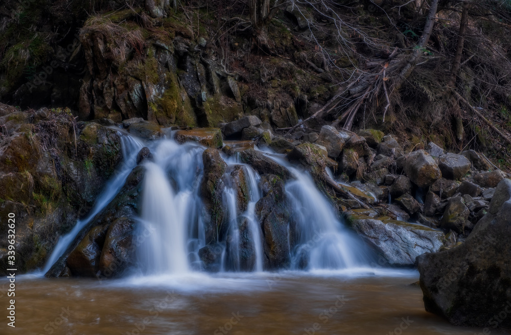 Kamyanka waterfall in Ukrainian Carpathian mountains. Long exposure shot, april 2020