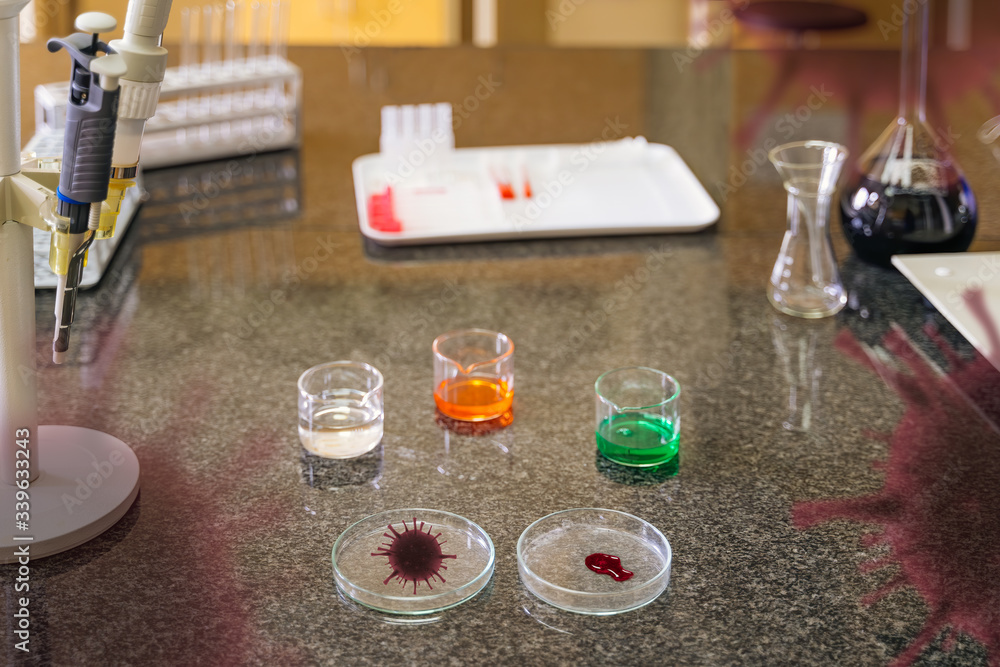 Coronavirus infected blood sample in lab glassware in laboratory ready for research for covid 19 vaccination with translucent virus cell graphic Coronavirus infected blood sample in lab glassware in laboratory ready for research for covid 19 vaccination with translucent virus cell graphic