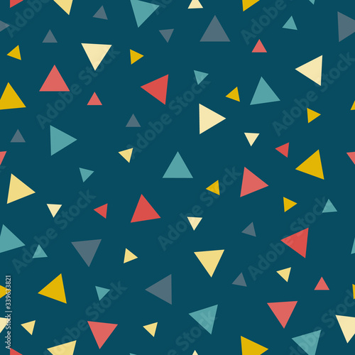 Colorful scattered confetti triangles on a dark background vector seamless pattern