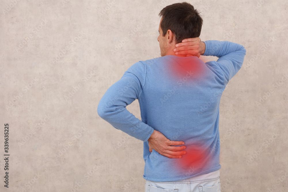 Man with neck and lower back pain, Sport injury. Pain Relief and Health Care Concept.