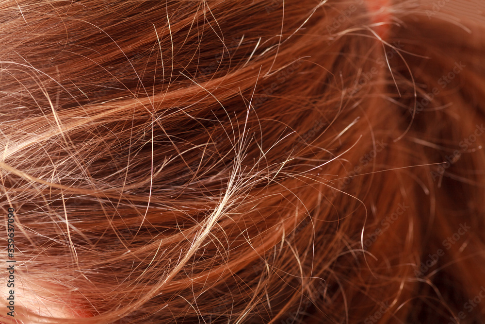 Naklejka premium Macro image of brown hair of the woman as background