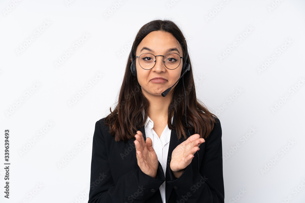 Young telemarketer woman isolated on white background applauding after presentation in a conference Young telemarketer woman isolated on white background applauding after presentation in a conference