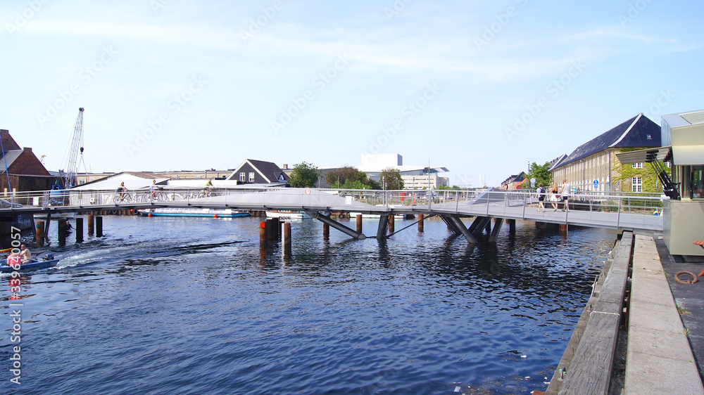 COPENHAGEN, DENMARK - JUL 05th, 2015: Beautiful pedestrian, bicycle bridge over the canal