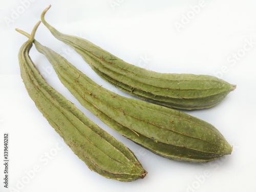 Vegetable - Ridged gourd (Luffa acutangula) is commercially grown for its unripe fruits used as a vegetable. It ranges from central and eastern Asia to southeastern Asia. Also known as angled luffa. photo