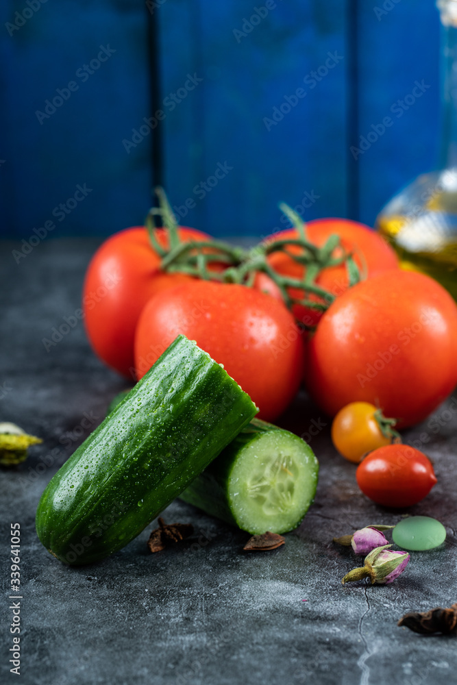 Red cherry tomatoes and green cucumbers