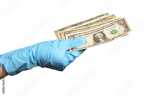 Hand in blue protective gloves with money isolated on white background.