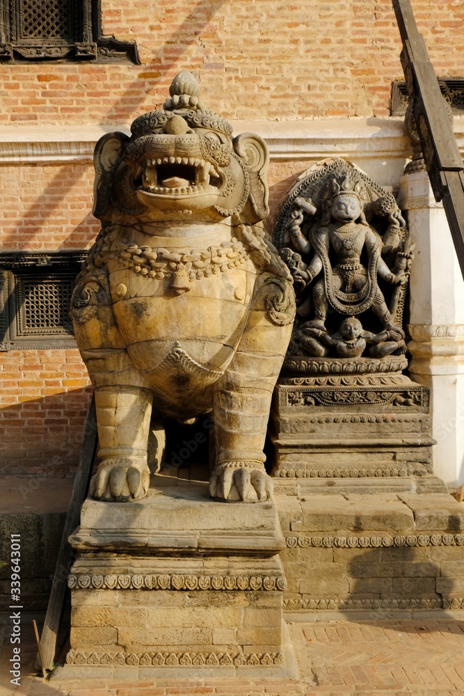 Lion and Hanuman, the monkey god in stone at entrance of National Art Gallery at Durbar Square, Bhaktapur, UNESCO World Heritage Site, Kathmandu Valley, Nepal, Asia