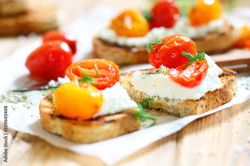 Bruschetta with ricotta cheese and sun-dried tomatoes with provencal herbs.