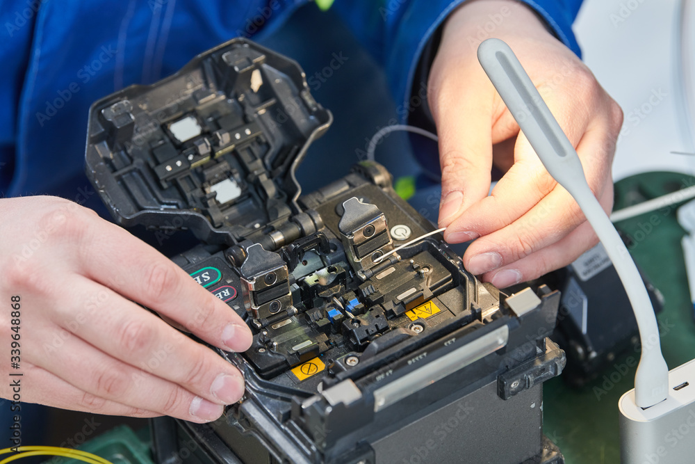 fusion splicer for fiber optic cable conection by welding. Electrical service fusion splicer for fiber optic cable conection by welding. Electrical service