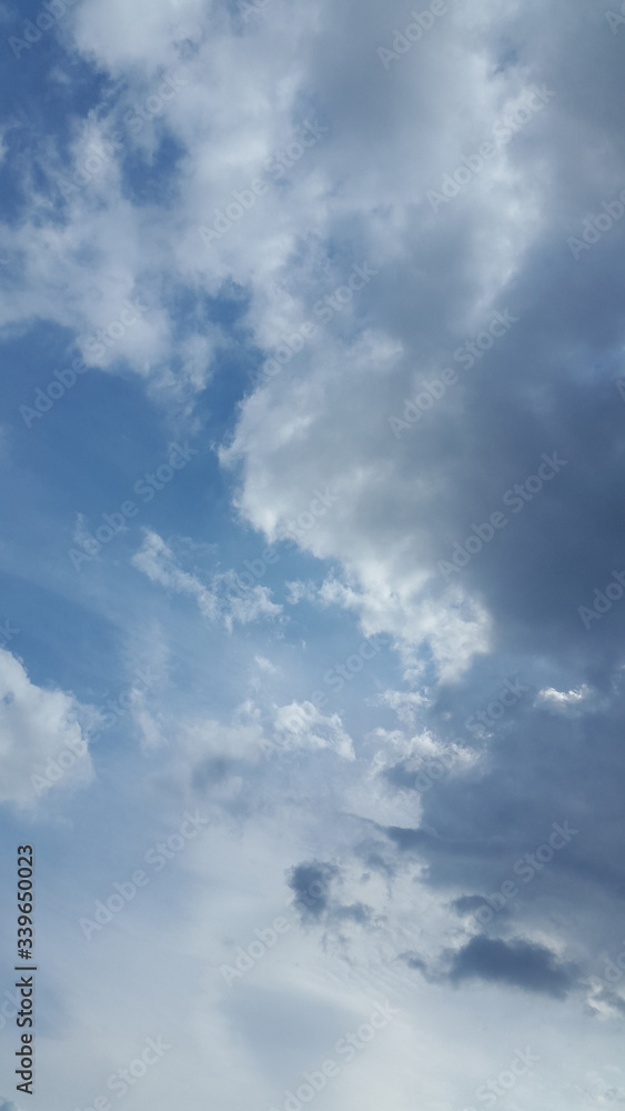 Clouds. Sky. Cloud background. Light white clouds on blue sky. Banner. Brochure