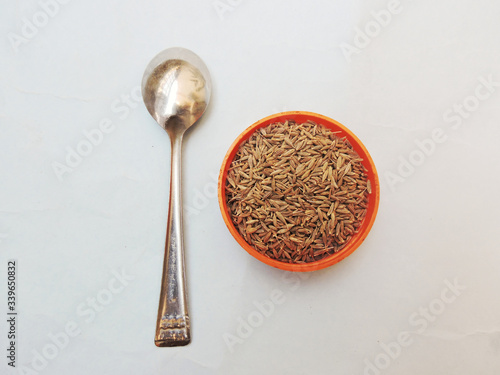 Cumin seeds in isolated white background.  photo