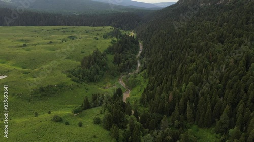 Aerial View, Russia. Adygea mountain. green forest and trees. Green hills and blue sky.