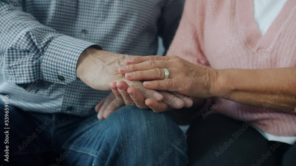 Slow motion of woman and man happy senior couple holding hands caressing expressing care and tenderness indoors. Love and relationship concept. Slow motion of woman and man happy senior couple holding hands caressing expressing care and tenderness indoors. Love and relationship concept.