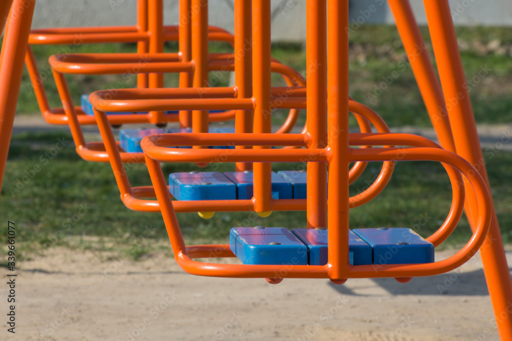 Children's swings in the yard. Sport and physical development of children.