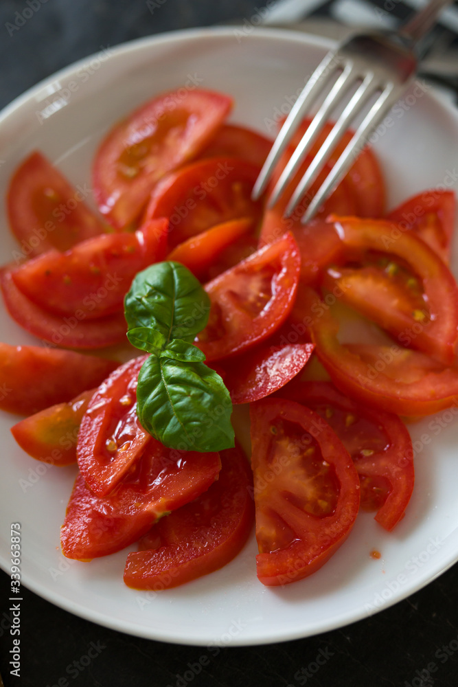 vegetarian food, raw tomatoes with basil leaf vegetarian food, raw tomatoes with basil leaf