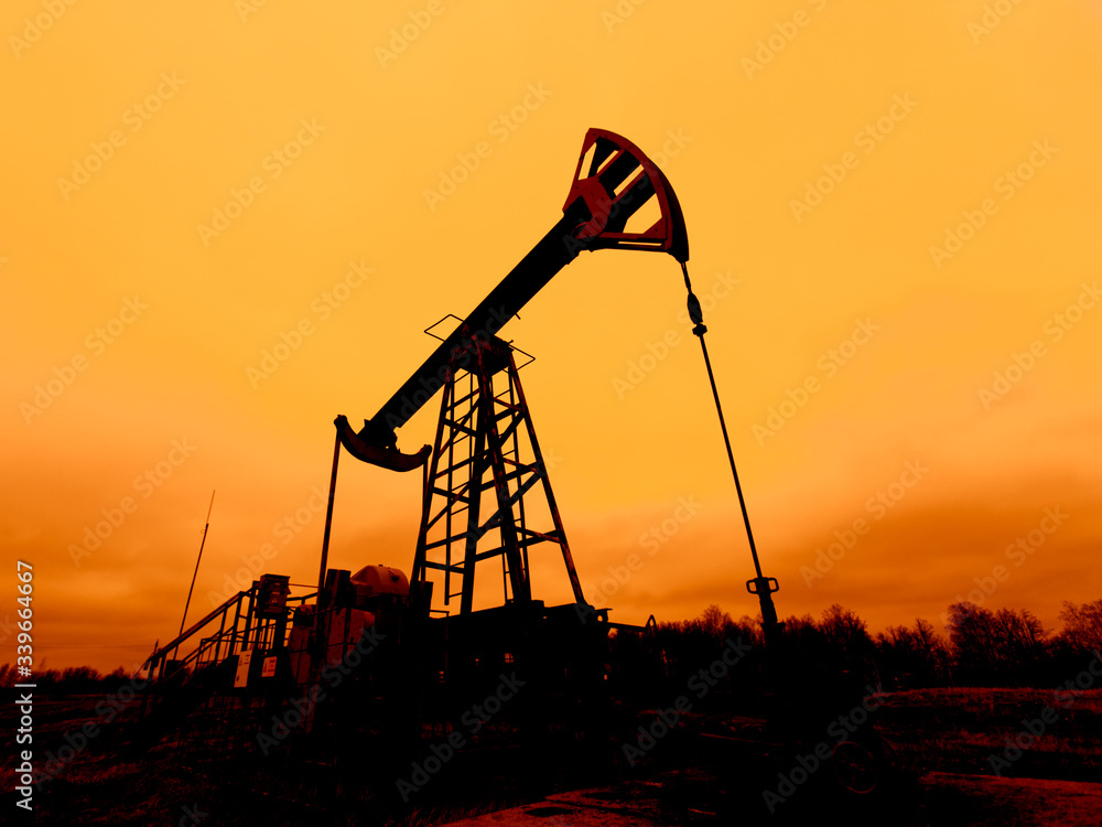 Oil pump oil rig energy industrial machine for petroleum in the sunset background for design. Oil pump oil rig energy industrial machine for petroleum in the sunset background for design.