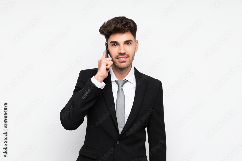 Young businessman with mobile phone over isolated white background Young businessman with mobile phone over isolated white background