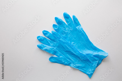 Blue medical gloves on a white background. Copy space. covid-19 protection. Coronavirus Epidemic © Ilnur