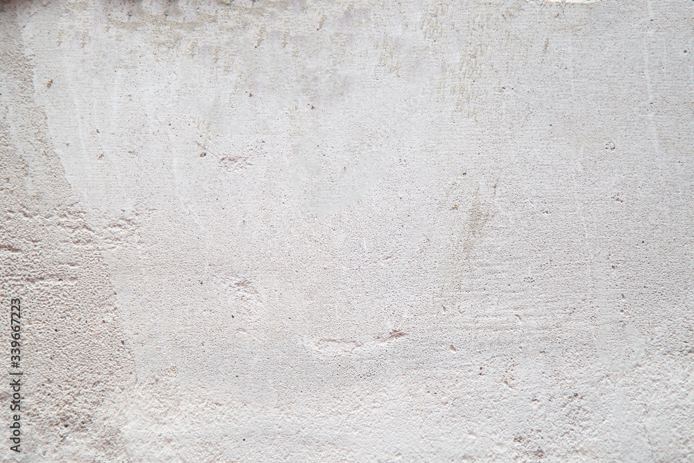 Fototapeta premium Cement grey background. Grey cement wall during the construction of a house.