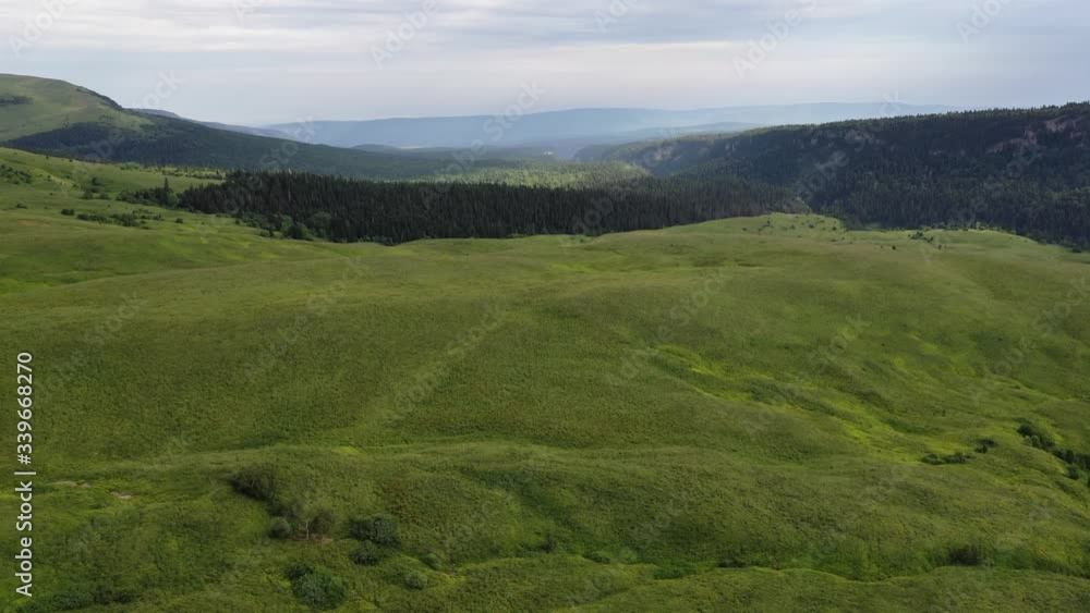 Aerial view, green valley, forest and hills in Adygea. Top View. Russia. Aerial view, green valley, forest and hills in Adygea. Top View. Russia.