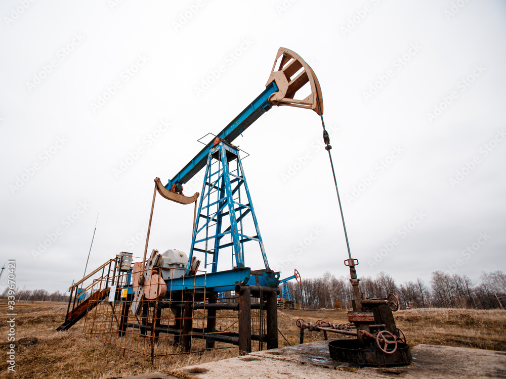 Green Oil pump oil rig energy industrial machine for petroleum crude. oil crisis. Russia pumps oil pollution. Green Oil pump oil rig energy industrial machine for petroleum crude. oil crisis. Russia pumps oil pollution.