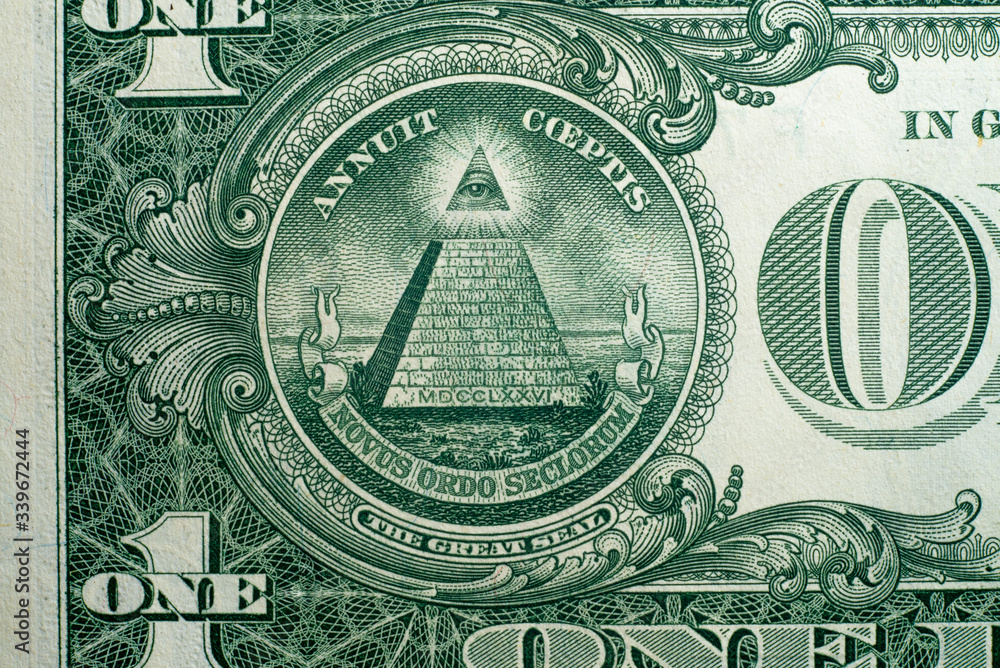 Obraz premium Annuit coeptis motto and the Eye of Providence on the reverse side of American one dollar bill.