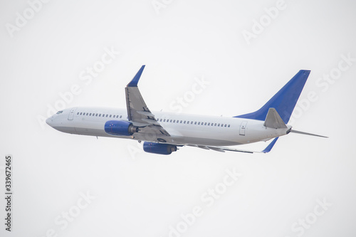 White passenger plane taking off