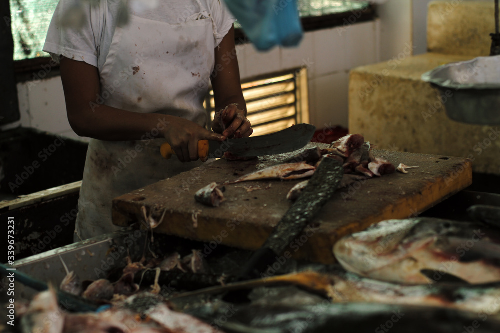 Man working at the seafood market Man working at the seafood market