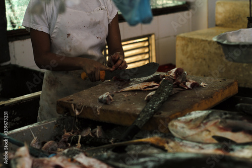 Man working at the seafood market © Sergio