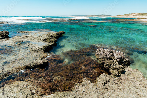 Fototapeta Naklejka Na Ścianę i Meble -  Blue Holes Beach, Kalbarri National Park, Western Australia. Clear turquoise waters of the ocean and coastal limestone coral reef. Scenic snorkelling destination