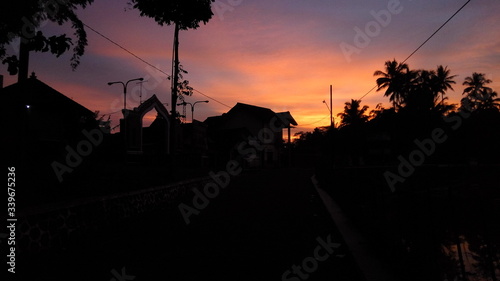 the view of the sunrise in the Mekukuhan cemetery complex in the village of Kedu, Temanggung district, Central Java, Indonesia. (motion blurry soft focus noise)