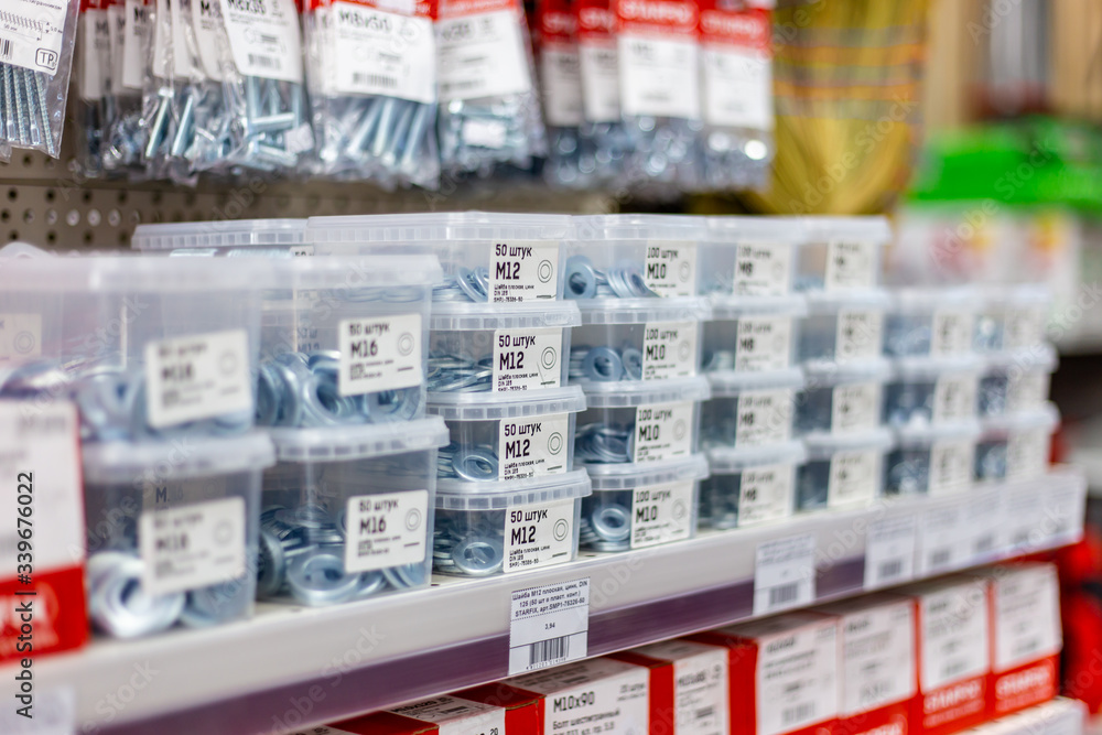 in a large hardware store, a department of screws and nails in a display case Belarus, Minsk, April 11, 2020.