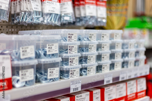 in a large hardware store, a department of screws and nails in a display case Belarus, Minsk, April 11, 2020.
