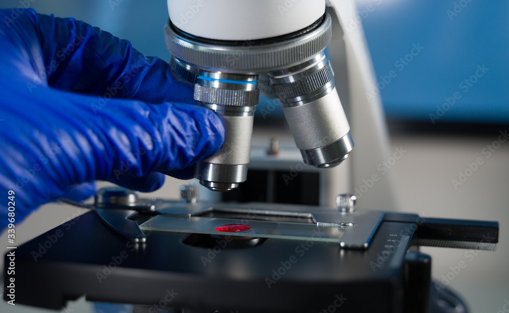 Close-up shot of laboratory microscope with blood sample. Close-up shot of laboratory microscope with blood sample.