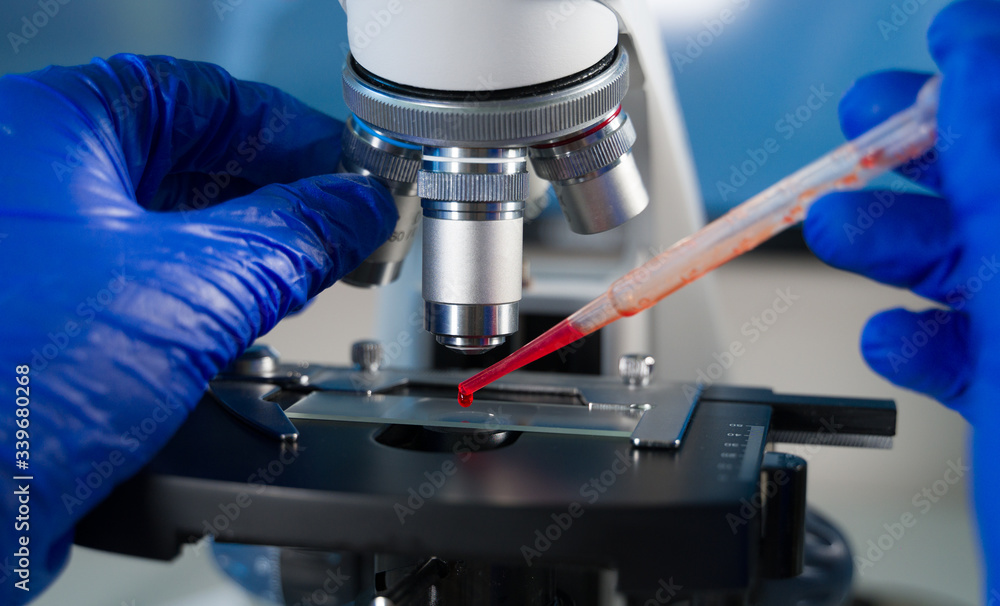Close-up shot of laboratory microscope with blood sample. Close-up shot of laboratory microscope with blood sample.