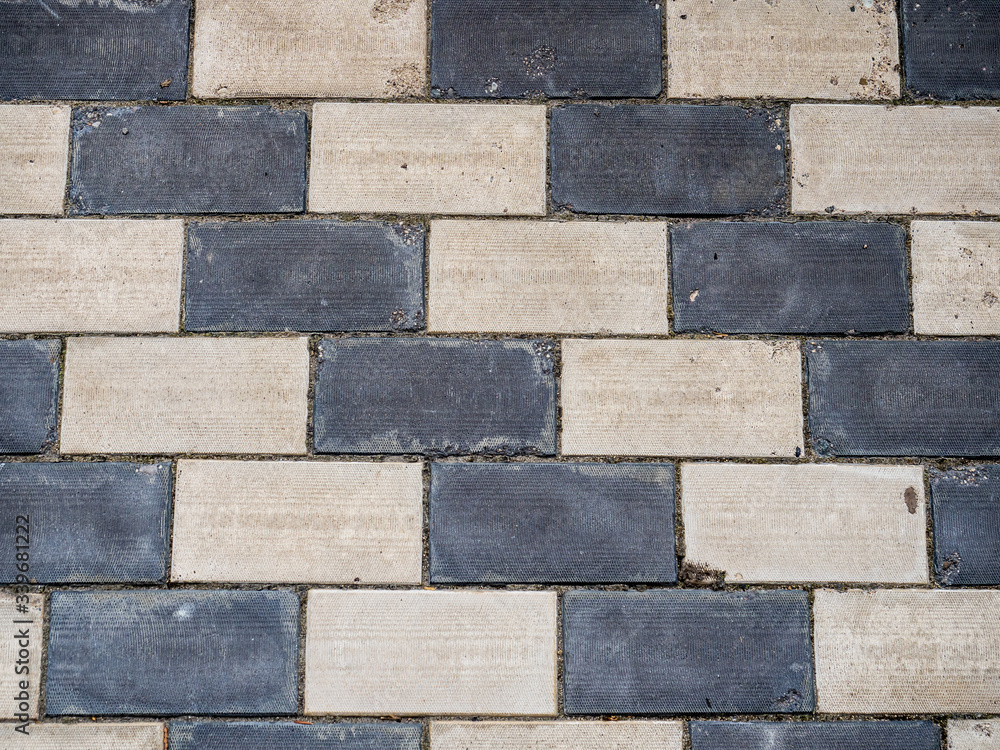 Fototapeta premium Texture of black and white paving slabs top view