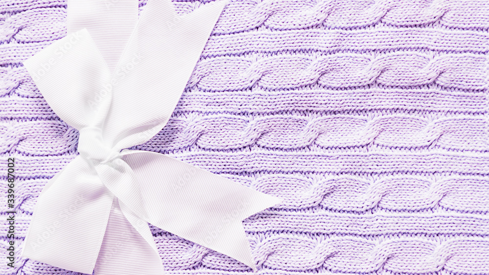 Baby knitted soft violet blanket with bow for newborn baby, 16:9 panoramic format Baby knitted soft violet blanket with bow for newborn baby, 16:9 panoramic format