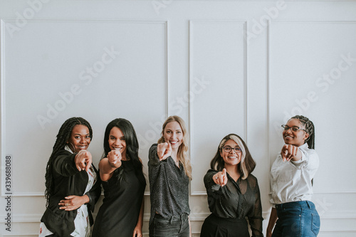 Professional women pointing the camera