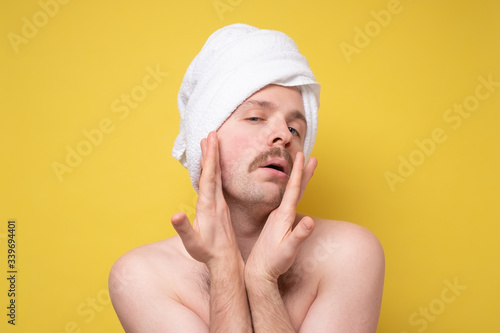 man beautify making face massage for better male macho appearence photo